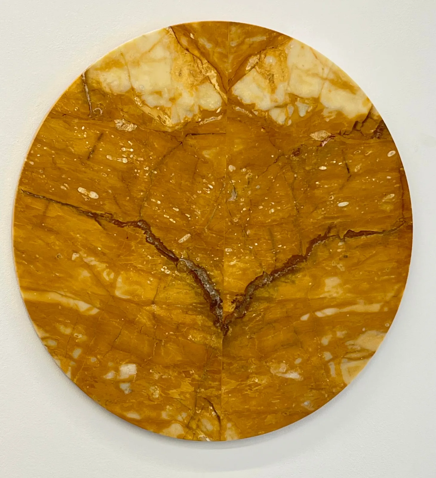 Linda Carrara, Equinozio di Marzo, 2024. Siena yellow marble with open stain · 60 × 60 cm